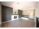 Bright living room featuring a modern fireplace, and stairway with black iron railing at 2111 Loro Ct, Las Vegas, NV 89117