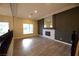 Cozy living area featuring a fireplace with decorative tile and a mirrored accent at 2111 Loro Ct, Las Vegas, NV 89117