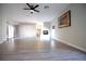 Large living room featuring hardwood floors, neutral paint, and a fireplace at 2111 Loro Ct, Las Vegas, NV 89117