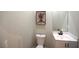 Cozy powder room with a modern vanity, toilet, and decorative artwork at 2111 Loro Ct, Las Vegas, NV 89117