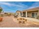 Back yard with stone benches, a picnic table, and patio at 2217 Merrimack Valley Ave, Henderson, NV 89044