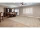 Open dining room featuring modern lighting, large windows, and a spacious carpeted area at 2217 Merrimack Valley Ave, Henderson, NV 89044