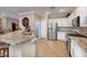 Well-lit kitchen featuring granite countertops, stainless steel appliances, and tile flooring at 2217 Merrimack Valley Ave, Henderson, NV 89044