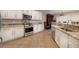 Well-lit kitchen featuring granite countertops, stainless steel appliances, and tile flooring at 2217 Merrimack Valley Ave, Henderson, NV 89044