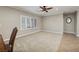 Open concept living space featuring modern lighting, large windows, and a spacious carpeted area at 2217 Merrimack Valley Ave, Henderson, NV 89044