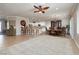 Open-concept living space showcasing dining, kitchen and bar seating with a large carpet area at 2217 Merrimack Valley Ave, Henderson, NV 89044