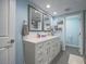 Bathroom showcasing double sinks, modern fixtures, and ample cabinet space at 261 W Cypress Dr, Henderson, NV 89015