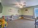Bedroom with ample open space, natural lighting, and a ceiling fan at 261 W Cypress Dr, Henderson, NV 89015