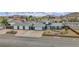 Charming single-story home with a four-car garage, quaint landscaping and mountain views at 261 W Cypress Dr, Henderson, NV 89015