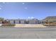 Attractive single-story home with four-car garage and desert landscaping at 261 W Cypress Dr, Henderson, NV 89015