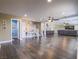 Open-concept living area features hardwood floors, staircase, and abundant natural light at 261 W Cypress Dr, Henderson, NV 89015