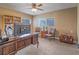 Office features a large desk, comfortable seating and ample natural light at 261 W Cypress Dr, Henderson, NV 89015