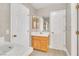 Bathroom featuring single sink vanity and tiled walls at 2617 Huber Heights Dr, Las Vegas, NV 89128