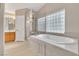 Bathroom featuring a modern tub, shower, and vanity at 2617 Huber Heights Dr, Las Vegas, NV 89128