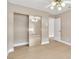 Bright bedroom with hardwood floors, ceiling fan, and closet with mirrored doors at 2617 Huber Heights Dr, Las Vegas, NV 89128