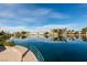 Still lake view with lush greenery and a railing in a tranquil community setting at 2617 Huber Heights Dr, Las Vegas, NV 89128