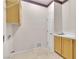 Functional laundry room featuring a sink, cabinet, and overhead rack for storage at 2617 Huber Heights Dr, Las Vegas, NV 89128