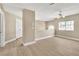 Bright loft area with wood-style flooring, a ceiling fan, and natural light from the window at 2617 Huber Heights Dr, Las Vegas, NV 89128