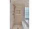 Modern shower with glass door and tiled walls in the bathroom at 2617 Huber Heights Dr, Las Vegas, NV 89128