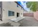 The backyard boasts a large concrete patio and gravel, offering a versatile space for outdoor living and entertaining at 2617 Romarin Ter, Henderson, NV 89044