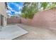 The spacious backyard features a concrete patio, gravel, and privacy wall perfect for relaxing and entertaining outdoors at 2617 Romarin Ter, Henderson, NV 89044