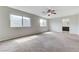 Spacious bedroom with ceiling fan, neutral walls, and natural light from multiple windows at 2617 Romarin Ter, Henderson, NV 89044