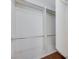 This walk-in closet provides ample storage with sturdy rod racks and shelving to keep your wardrobe organized at 2617 Romarin Ter, Henderson, NV 89044