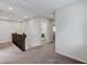 Upstairs hallway with carpeting and access to the laundry room featuring a new washing machine at 2617 Romarin Ter, Henderson, NV 89044