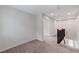 Upstairs hallway with carpet, white walls, and a dark wood banister adds architectural interest at 2617 Romarin Ter, Henderson, NV 89044