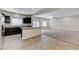 Open-concept kitchen with breakfast bar seamlessly connects to the spacious living area at 2617 Romarin Ter, Henderson, NV 89044