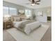 Main bedroom suite with neutral decor, recessed lighting, and a large window with natural light at 2617 Romarin Ter, Henderson, NV 89044
