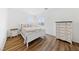 Cozy bedroom featuring neutral colors, hardwood floors, and bright natural light at 2682 Korea Ct, Henderson, NV 89052