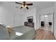 Bright bedroom features a ceiling fan and closet with a view into the next room at 2682 Korea Ct, Henderson, NV 89052