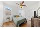 Cozy bedroom featuring a ceiling fan, natural light, and closet space at 2682 Korea Ct, Henderson, NV 89052