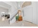 Bright foyer showcasing tile floors, a staircase, and natural light at 2682 Korea Ct, Henderson, NV 89052