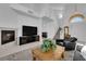 Comfortable living room featuring a fireplace and stylish furniture at 2682 Korea Ct, Henderson, NV 89052