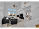 Spacious living room with vaulted ceilings, a fireplace, and abundant natural light at 2682 Korea Ct, Henderson, NV 89052