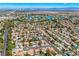 An aerial view displays the desirable suburban neighborhood with beautiful landscaping and community lakes at 2812 Shadow Creek Cir, Las Vegas, NV 89117