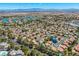 An aerial view displays the desirable suburban neighborhood with beautiful landscaping and community lakes at 2812 Shadow Creek Cir, Las Vegas, NV 89117