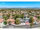 An aerial view displays the desirable suburban neighborhood with mature trees and well-maintained landscaping at 2812 Shadow Creek Cir, Las Vegas, NV 89117