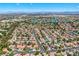 An aerial view displays the desirable suburban neighborhood with beautiful landscaping and community lakes at 2812 Shadow Creek Cir, Las Vegas, NV 89117