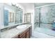 Bathroom with a vanity, sink, and a shower tub with tile surround at 2812 Shadow Creek Cir, Las Vegas, NV 89117