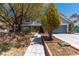 Home featuring a meticulously maintained front yard, walkway, mature landscaping and two car garage at 2812 Shadow Creek Cir, Las Vegas, NV 89117
