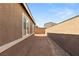 A blank canvas of a backyard awaits your landscaping ideas and outdoor enjoyment with privacy wall at 283 Fossil Falls St, Henderson, NV 89015