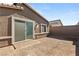 The blank canvas of the backyard is ready for customization and personalization with a brick-paver entrance at 283 Fossil Falls St, Henderson, NV 89015