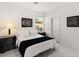 Bright bedroom featuring neutral decor, artwork, and a window for natural light at 283 Fossil Falls St, Henderson, NV 89015