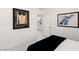 Bright bedroom featuring neutral decor, artwork, and a door to the bathroom at 283 Fossil Falls St, Henderson, NV 89015