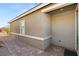 Exterior view of covered entryway showing brick pavers and neutral stucco siding at 283 Fossil Falls St, Henderson, NV 89015