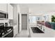 Modern kitchen featuring stainless steel appliances and white cabinetry at 283 Fossil Falls St, Henderson, NV 89015