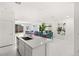 Open-concept living space with a modern kitchen and comfortable lounge area at 283 Fossil Falls St, Henderson, NV 89015